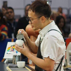 Dove Chen competing in a barista competition.