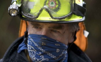 A fireman takes a break battling the Port Hills fire