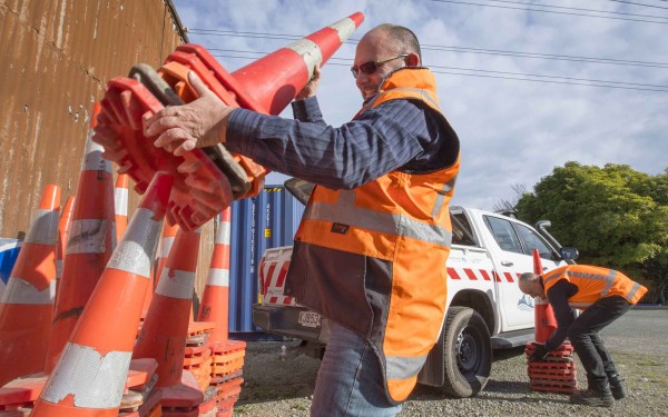 Council Traffic Engineer Wayne Anisy removing redundant cones.