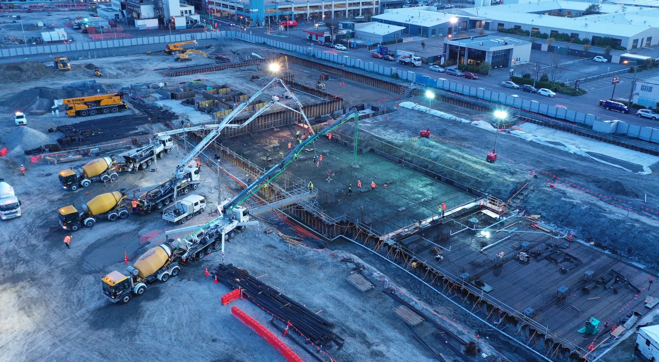 MSF concrete pour. Trucks pouring concrete at the metro sports facility site.